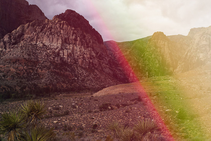 Una foto de un paisaje rocoso con superposiciones de fugas de luz creativas