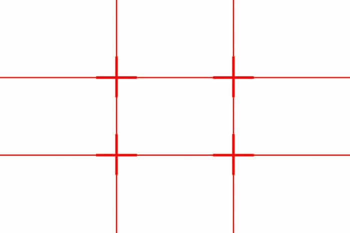 Una cuadrícula roja que muestra la cuadrícula de la regla de los tercios (dos líneas horizontales y dos líneas verticales)