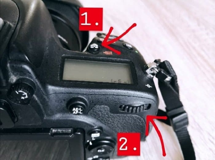 Un primer plano del cambio de modo de medición de una cámara