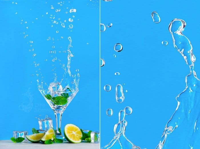 Fotografía dinámica de salpicaduras de agua con un vaso de mojito o limonada sobre un fondo azul brillante.  Refrescante concepto de bebida de verano con espacio para copiar.
