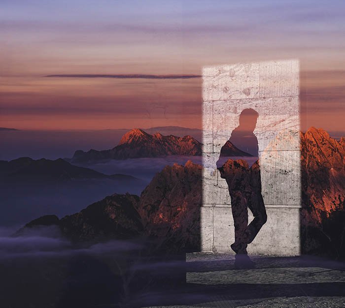Dos imágenes combinadas en una, usando una sombra masculina y un paisaje de montaña