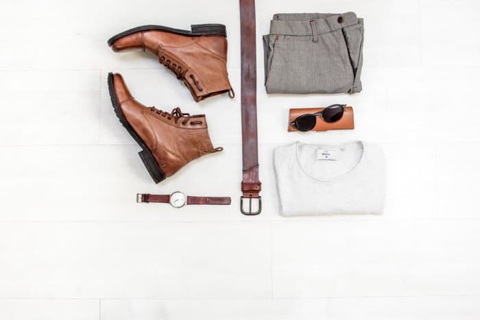 Flat lay product photo of shoes, watch, belt and clothes