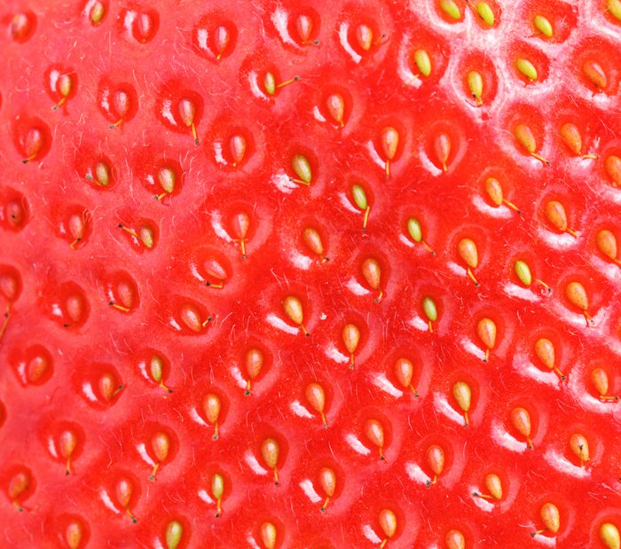una imagen macro de textura de fresa